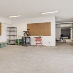 A bright and spacious industrial workshop with machinery and tools.