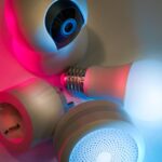Smart home devices including camera, sensor, and bulb with ambient neon lighting. Ideal for tech concepts.