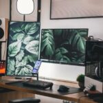 Stylish gaming and streaming setup with dual monitors, PC, and accessories.